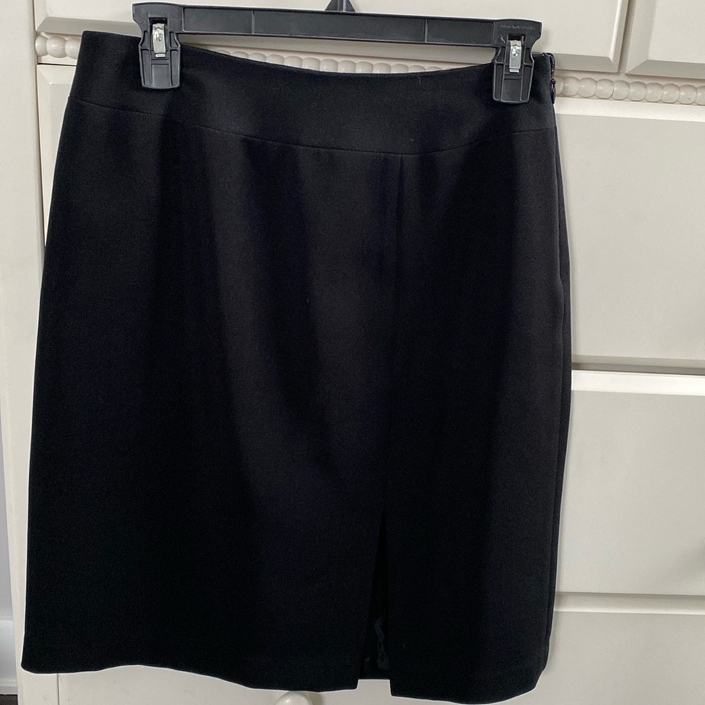 Mix it Classic Black Skirt with Front Slit. Size 4. 109% Polyester. Side Zip.